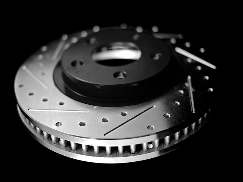 adam's rotors classic cross drilled and slotted machined through drill hole performance rotor with drilling and slots